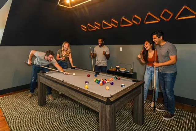 Spacious game room with a full-size pool table—ideal for family time, friendly competition, and relaxing evenings at home.