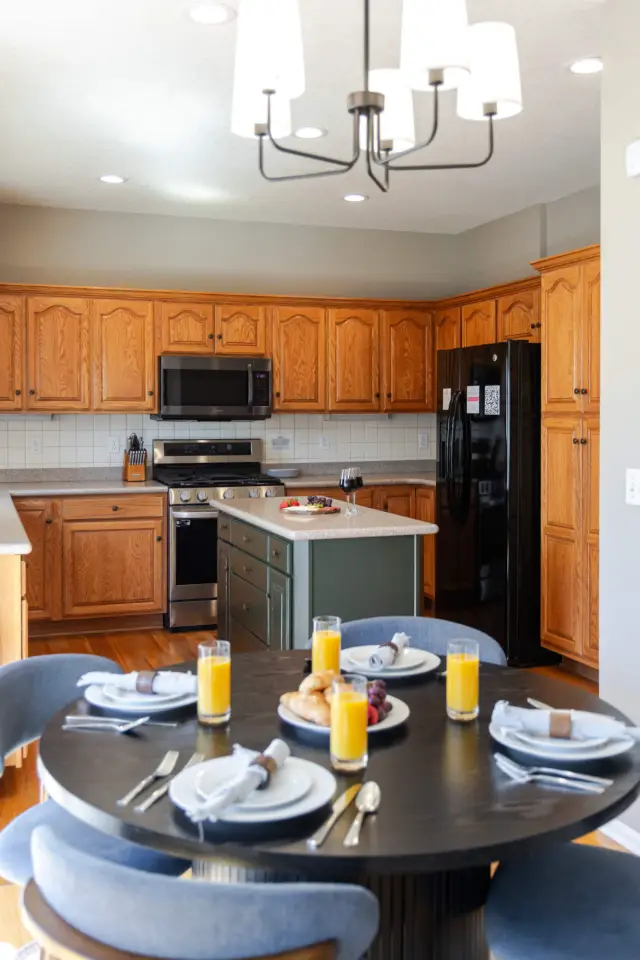 Breakfast nook seats 4 and is located in between the living room and a fully equipped kitchen.