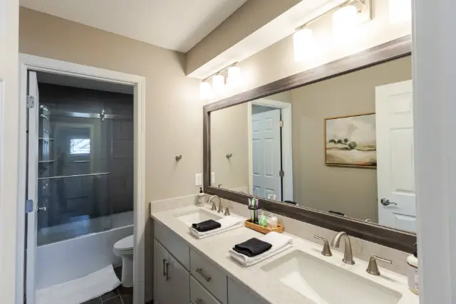 Full bath w shower and tub, dual vanity bath- located between Bedroom 2 and Bedroom 3.